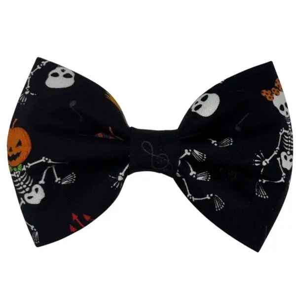 Halloween-themed bow tie with skeletons and pumpkins.