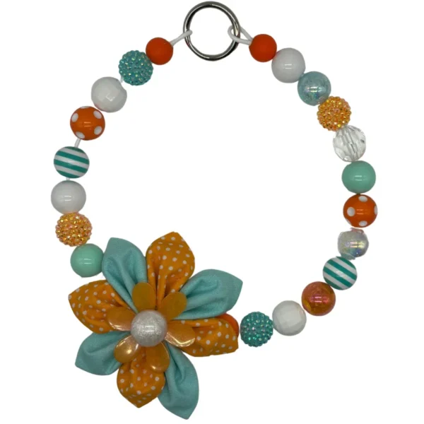 Colorful beaded necklace with fabric flower pendant.