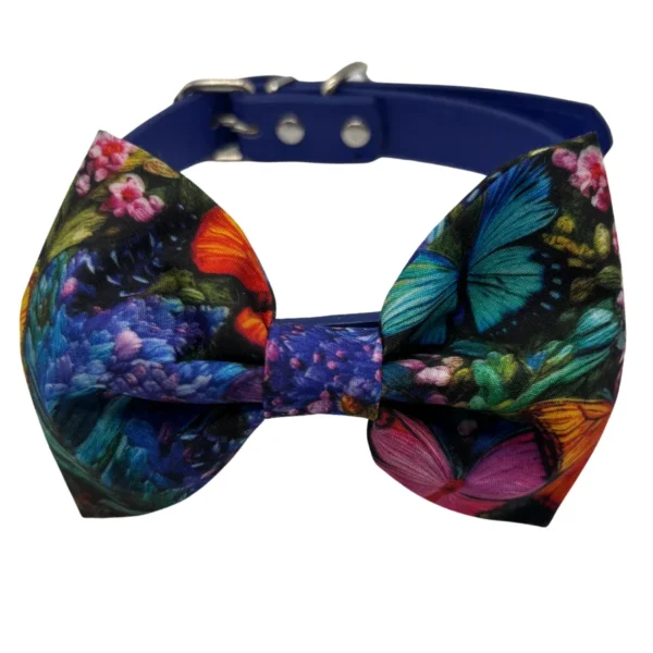 Colorful butterfly patterned bow tie on blue strap.