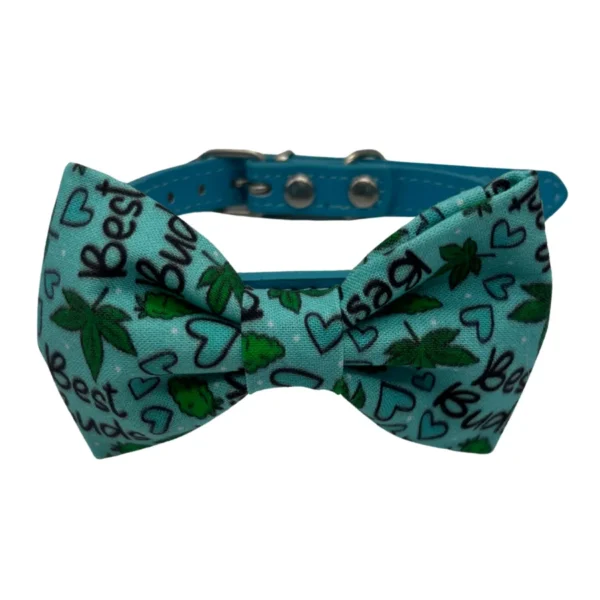Blue dog collar with bowtie and leaf pattern.